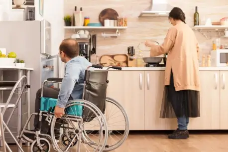 man in wheelchair opens refrigerator in kitchen 2026 01 08 02 15 47 utc (1)