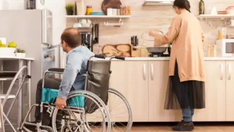 man in wheelchair opens refrigerator in kitchen 2026 01 08 02 15 47 utc (1)